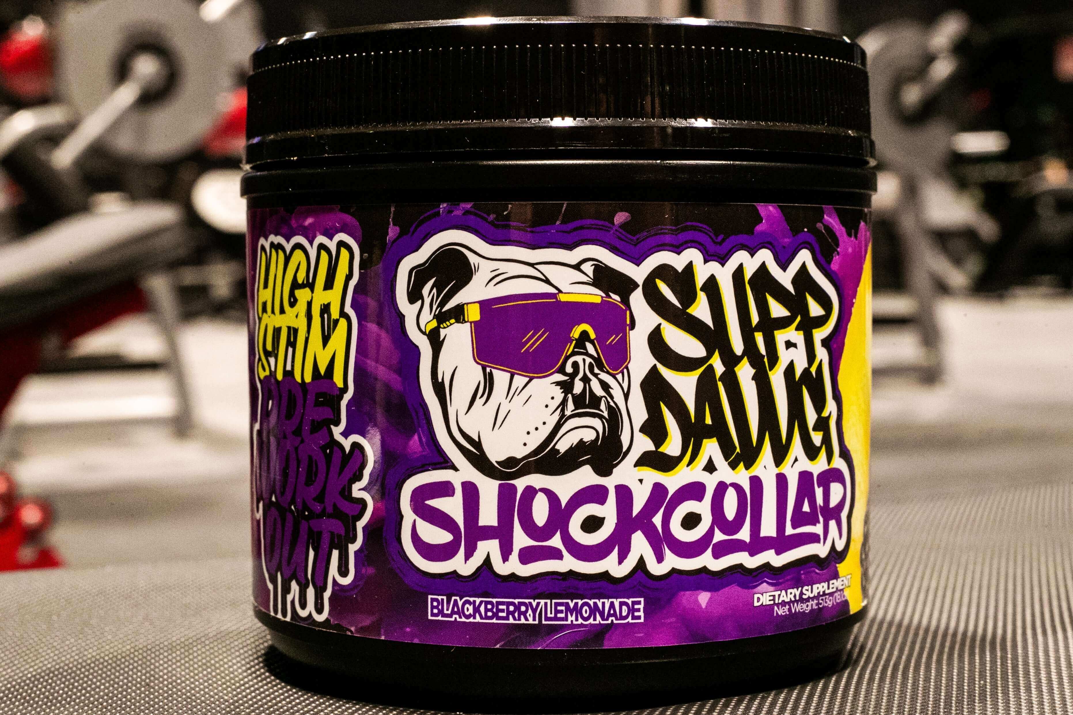 Supp Dawg Shock Collar high-stim pre-workout supplement in Blackberry Lemonade flavor tub.