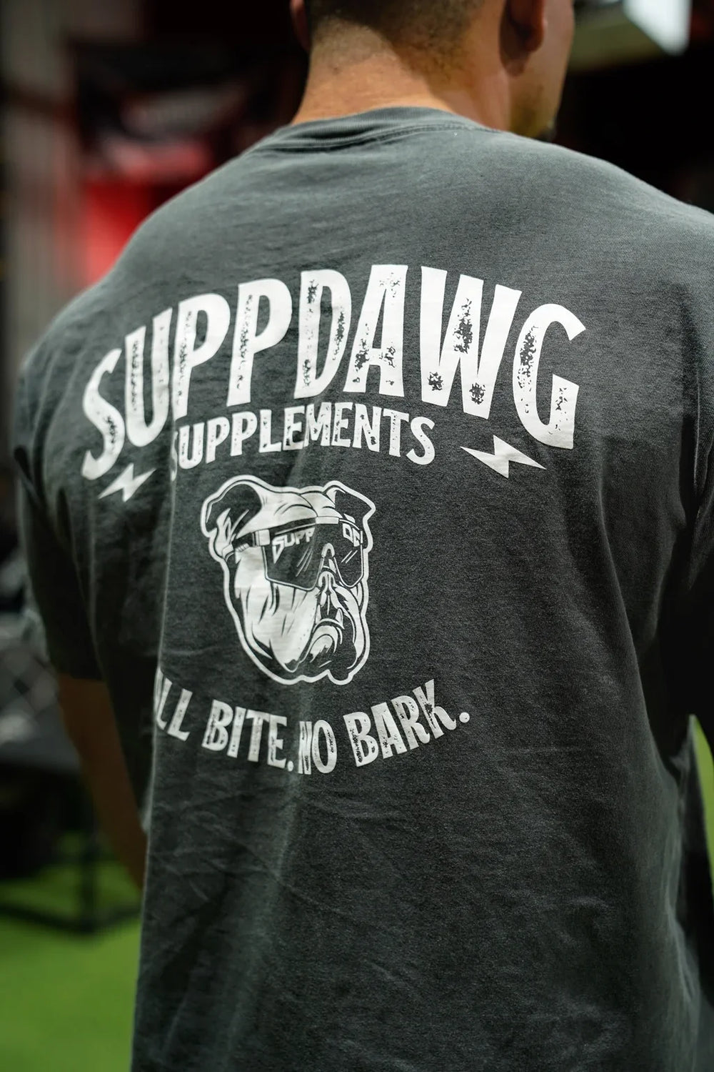 Athlete wearing a SuppDawg shirt at a gym