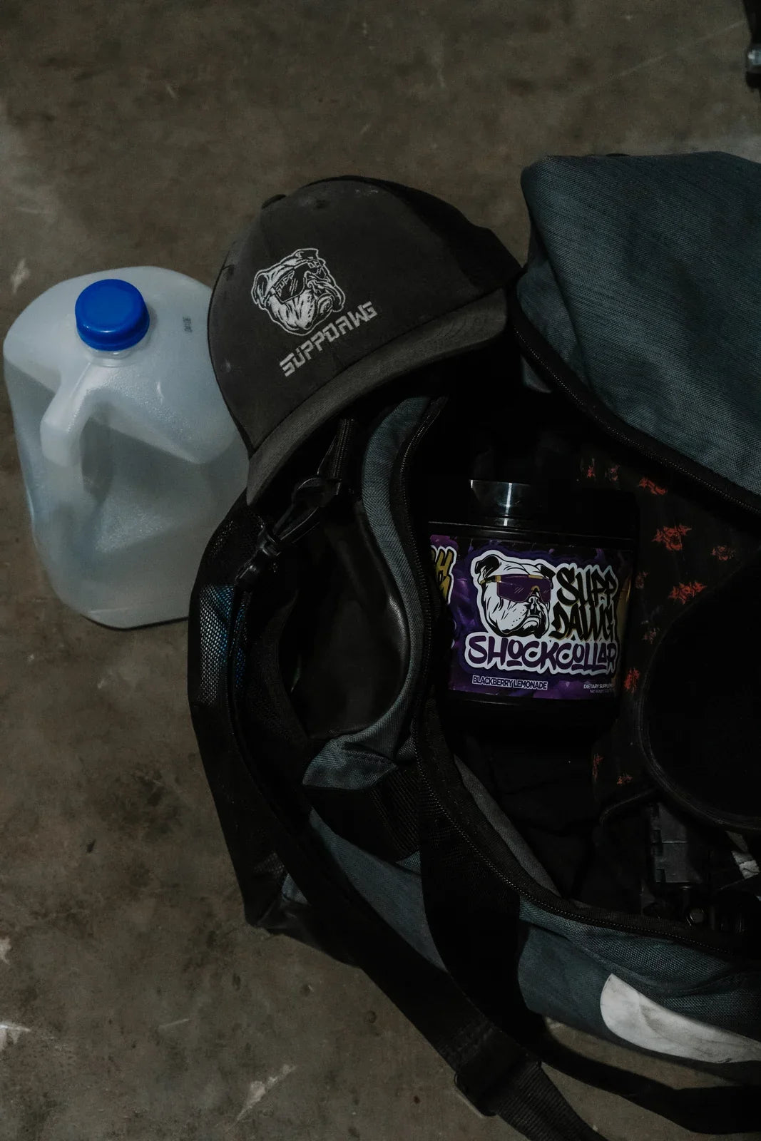 Training bag with a Shock Collar tub, SuppDawg cap and water container