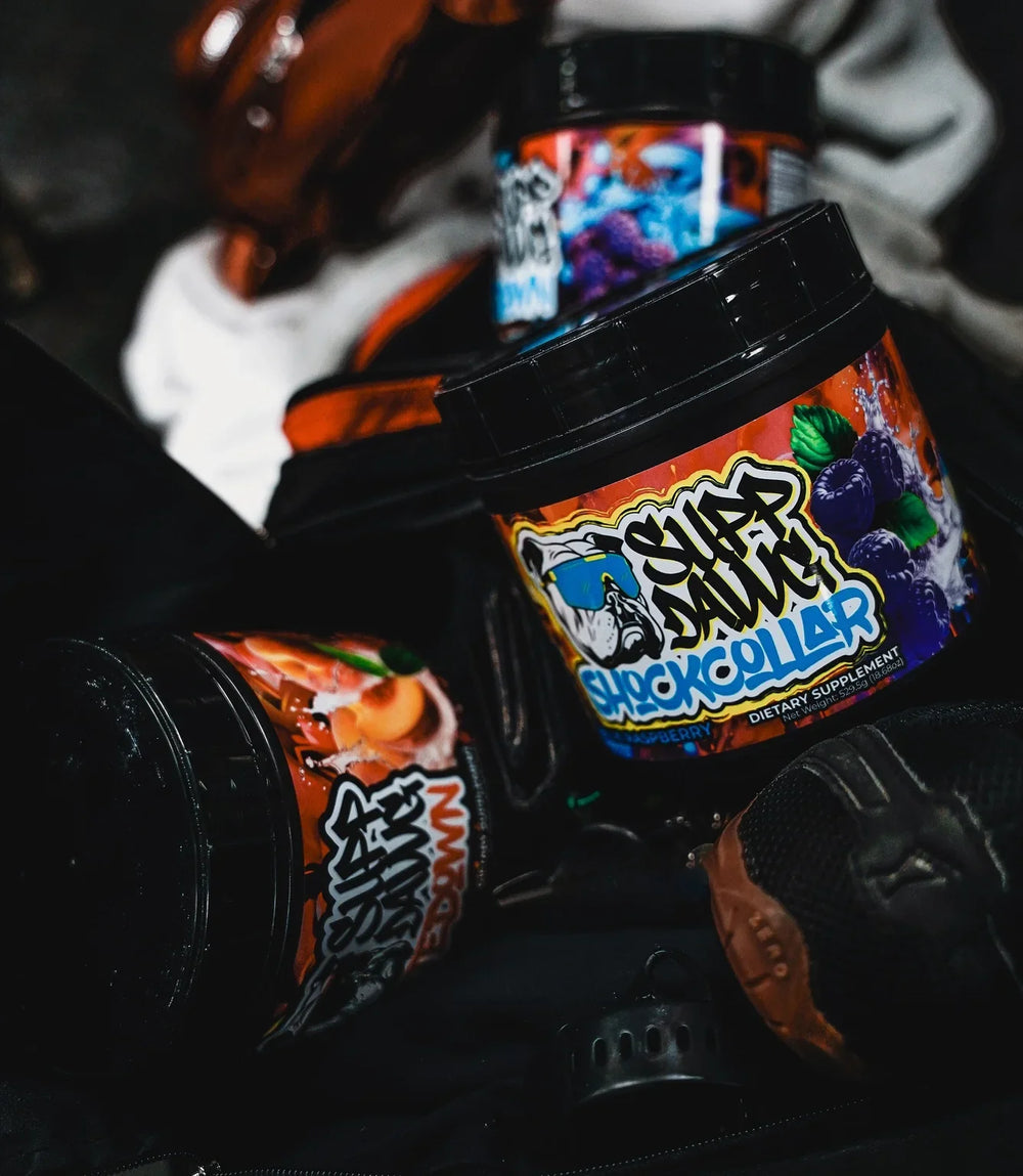 Different Shock Collar flavor tubs arranged with training gear