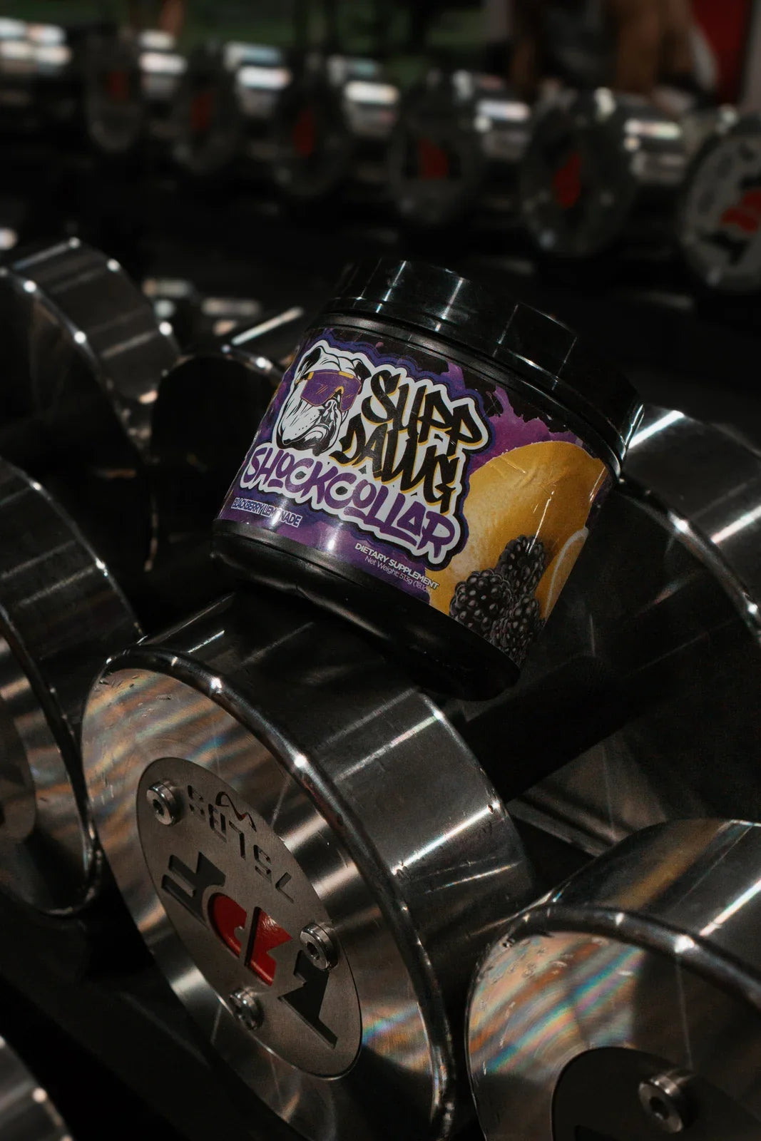 Shock Collar Blackberry Lemonade on a dumbbell rack