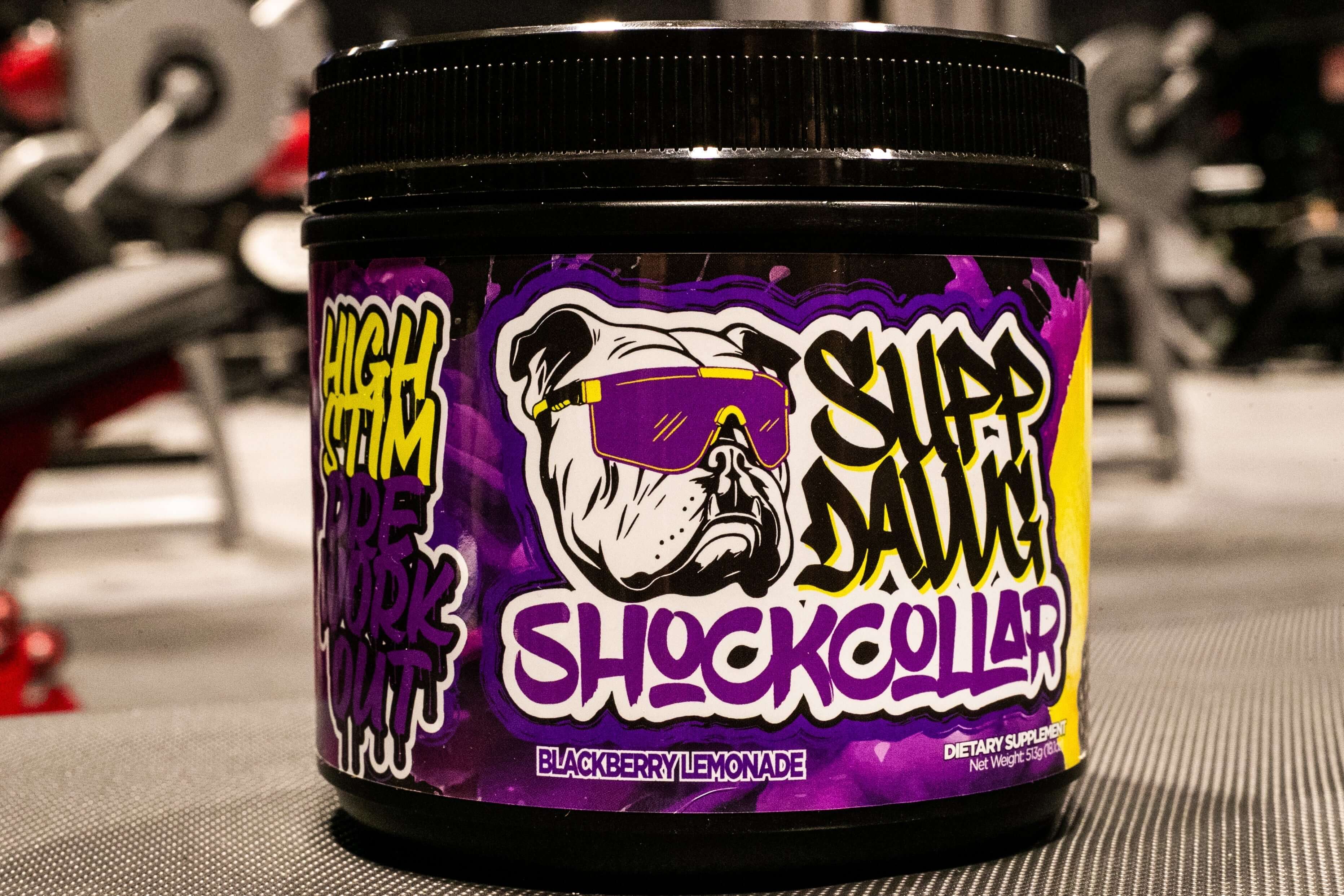 Supp Dawg Shock Collar high-stim pre-workout supplement in Blackberry Lemonade flavor tub.