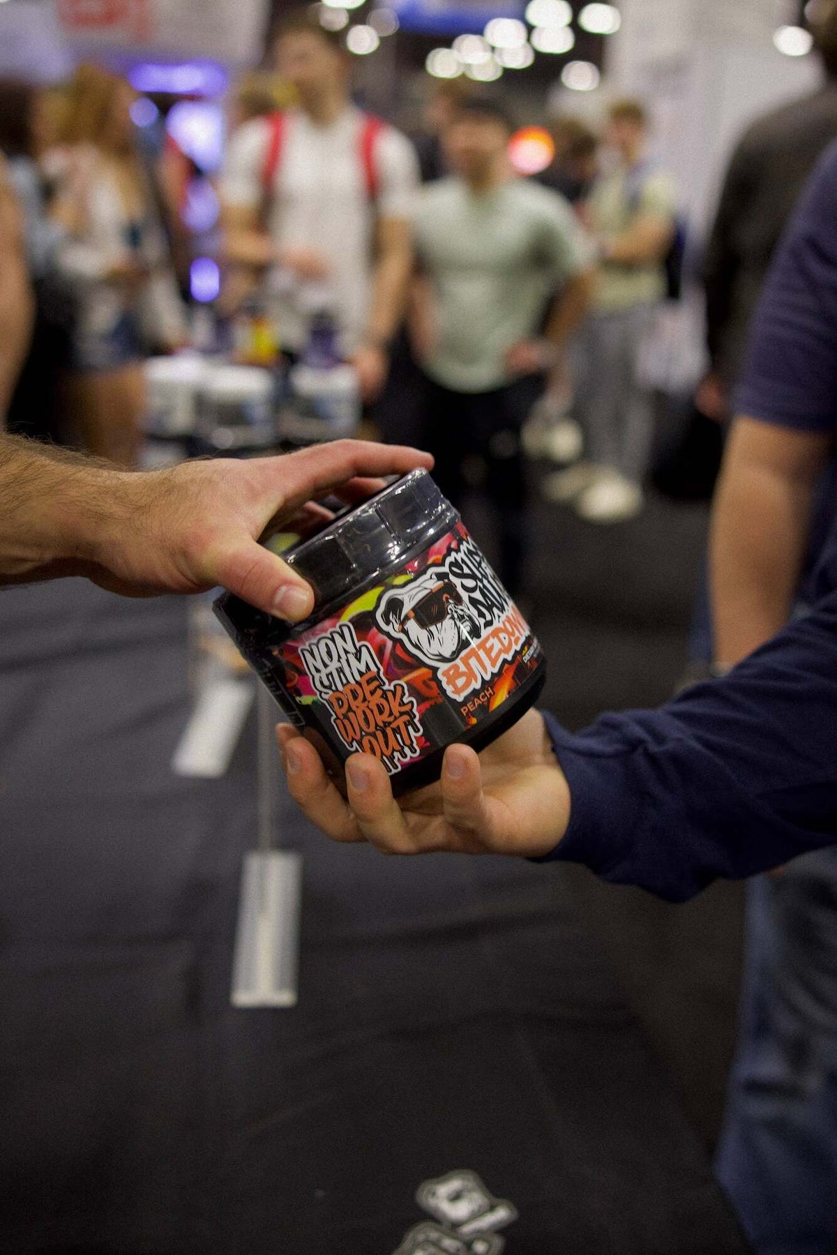 Bite Down Peach non-stim pre-workout held at a fitness event