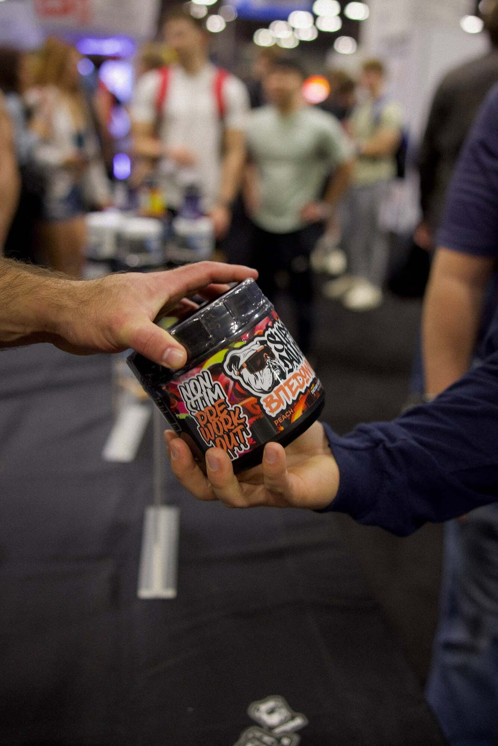 Bite Down Peach non-stim pre-workout held at a fitness event