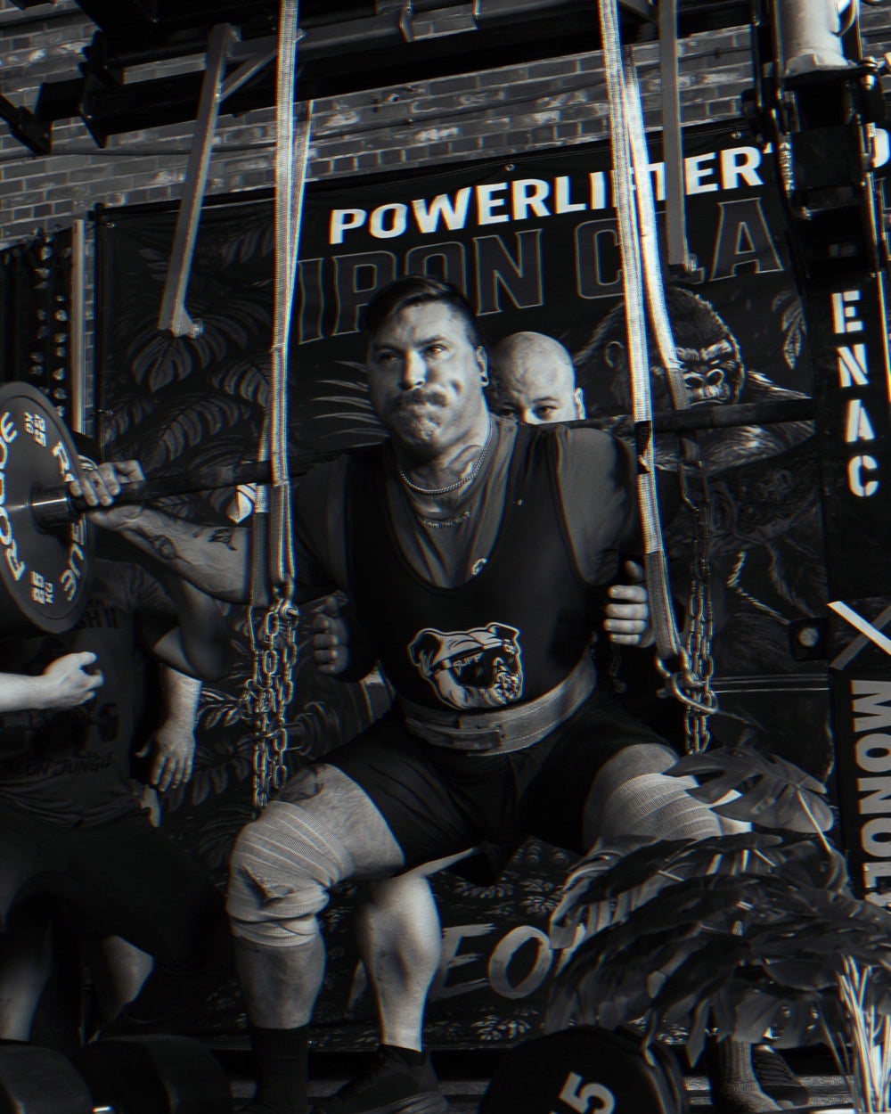 SuppDawg strength athlete preparing for a squat with spotters