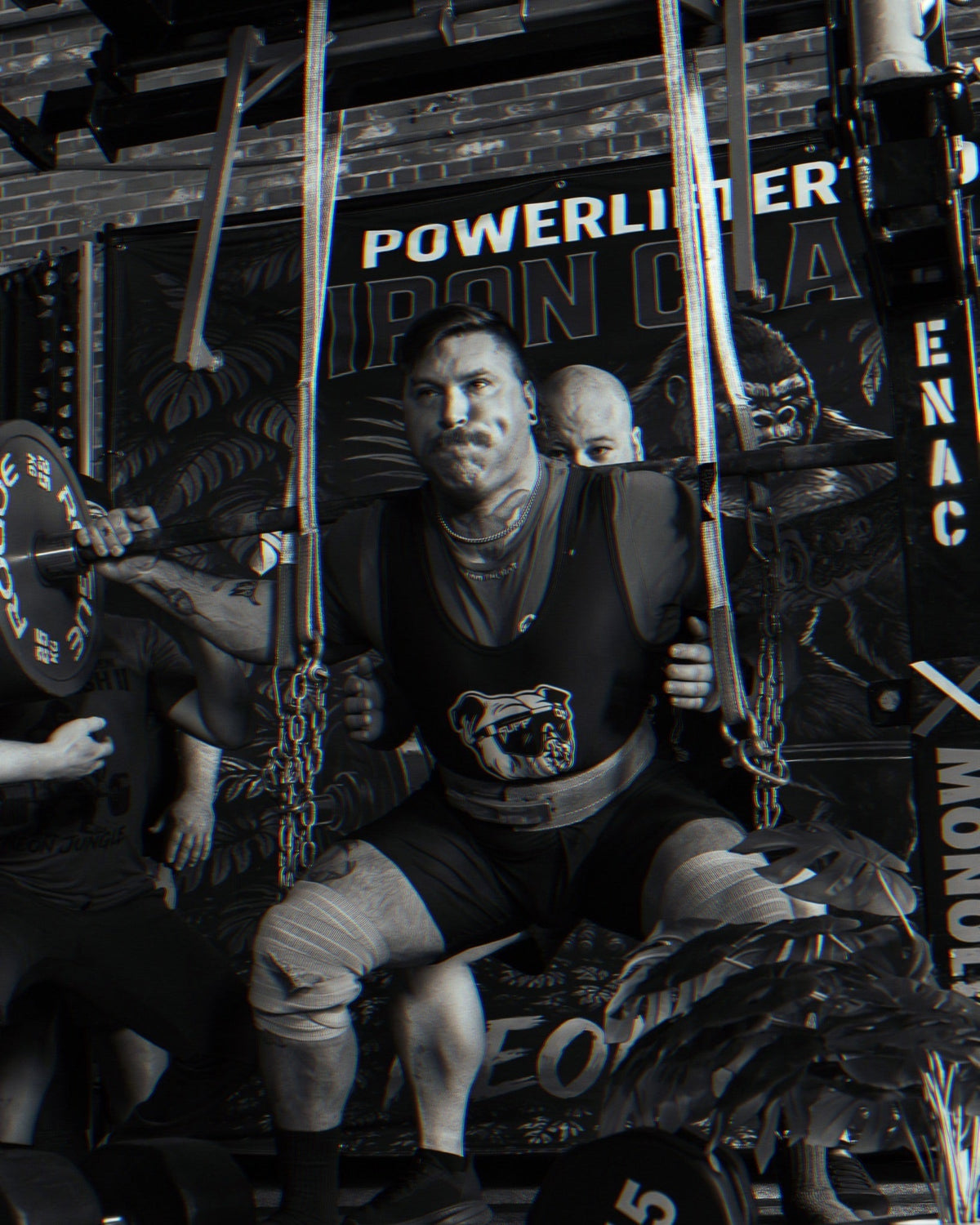 SuppDawg strength athlete preparing for a squat with spotters