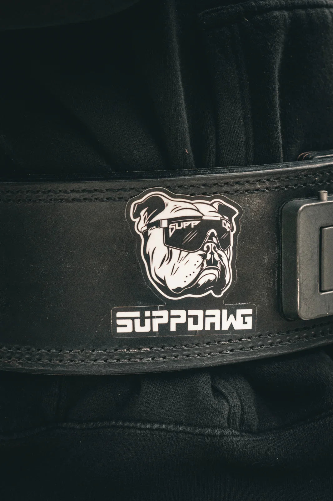 SuppDawg-branded lifting belt packed with training gear