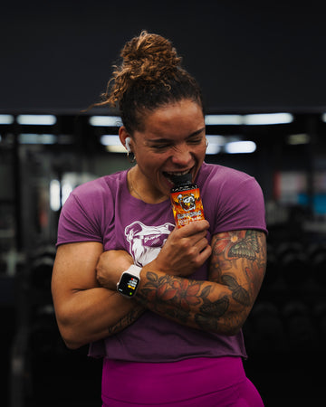 SuppDawg athlete holding HotDawg thermogenic support
