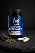Ruff Night bottle with three white capsules in a dark studio setting