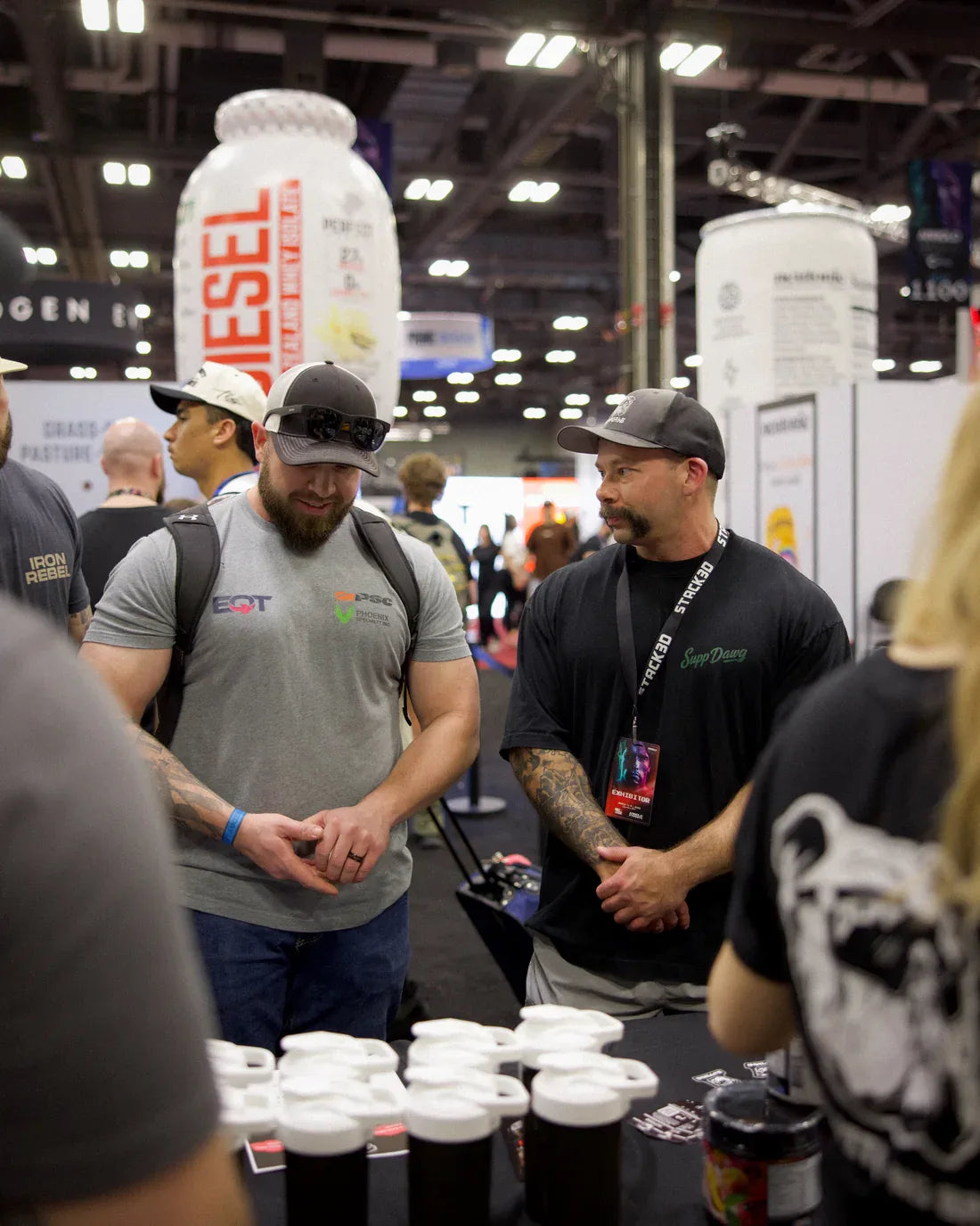SuppDawg founder Chris Northern talking with customers at a sports expo